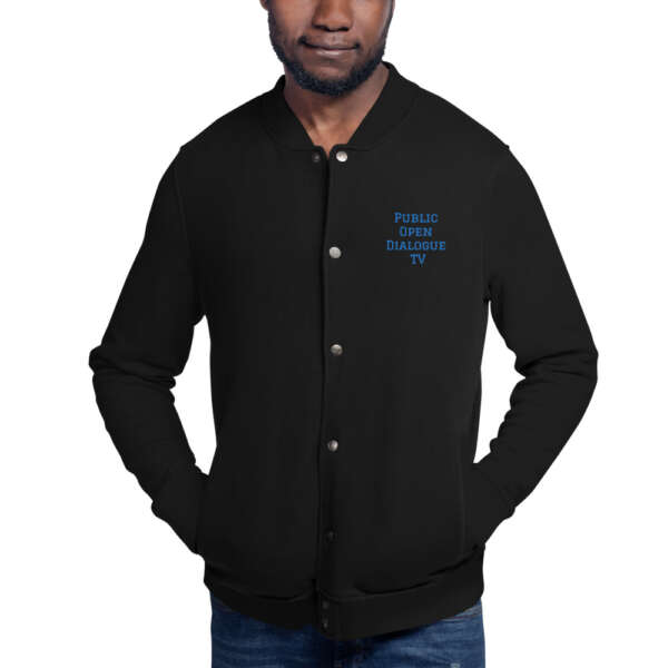 A man wearing a PODTV Champion Bomber Jacket with blue lettering.