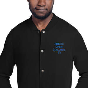 A man wearing a PODTV Champion Bomber Jacket with blue lettering.